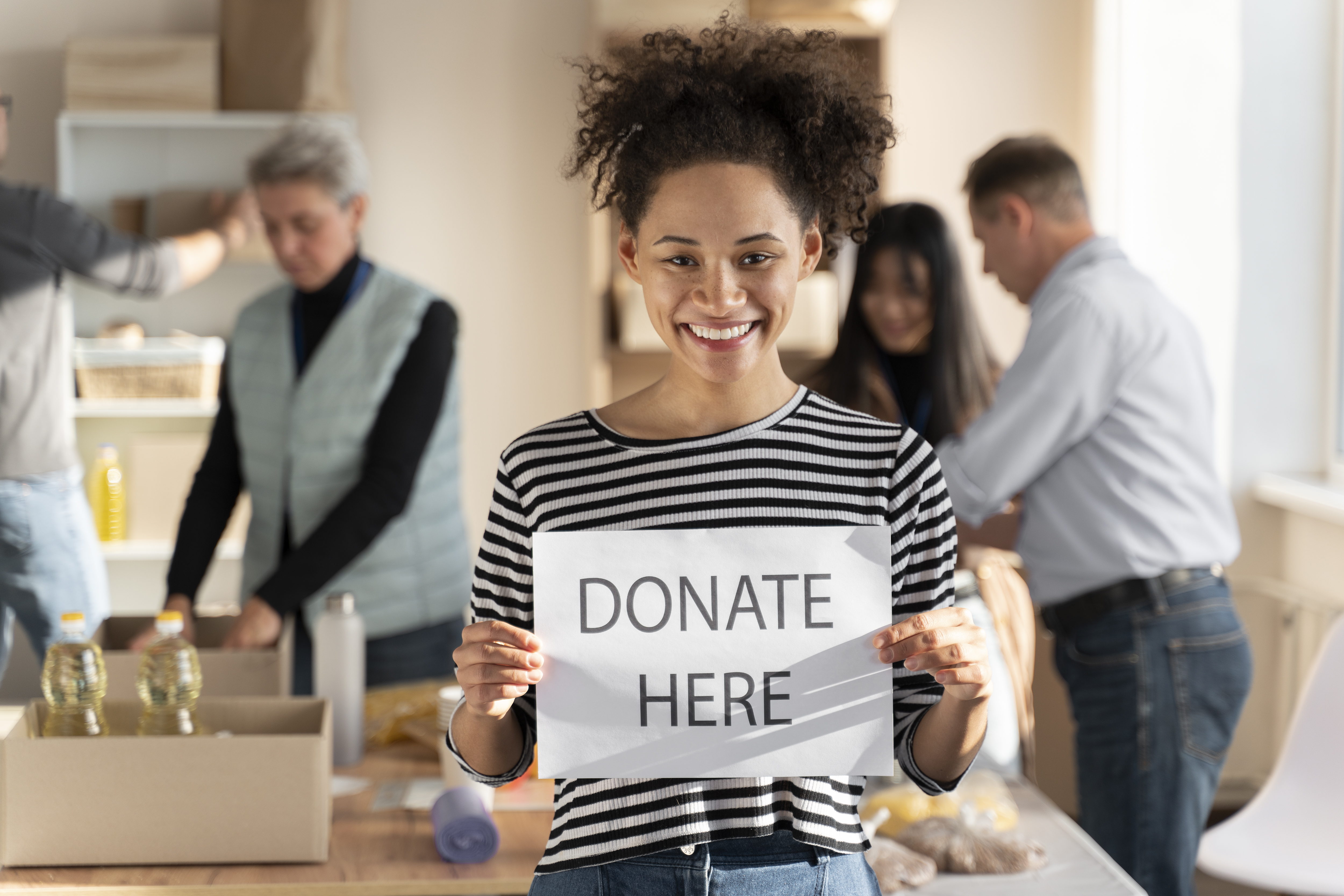 Nonprofit volunteers organizing donations and community support